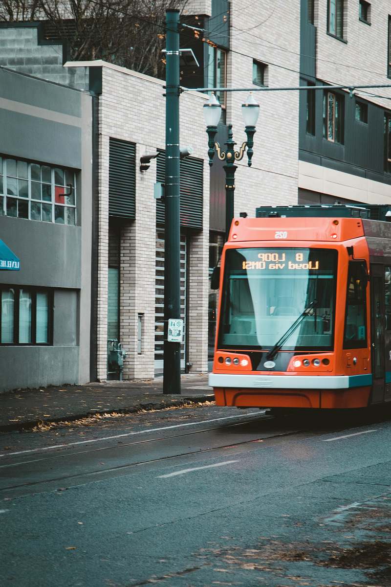 transportation orange and black vehicle on road at daytime vehicle